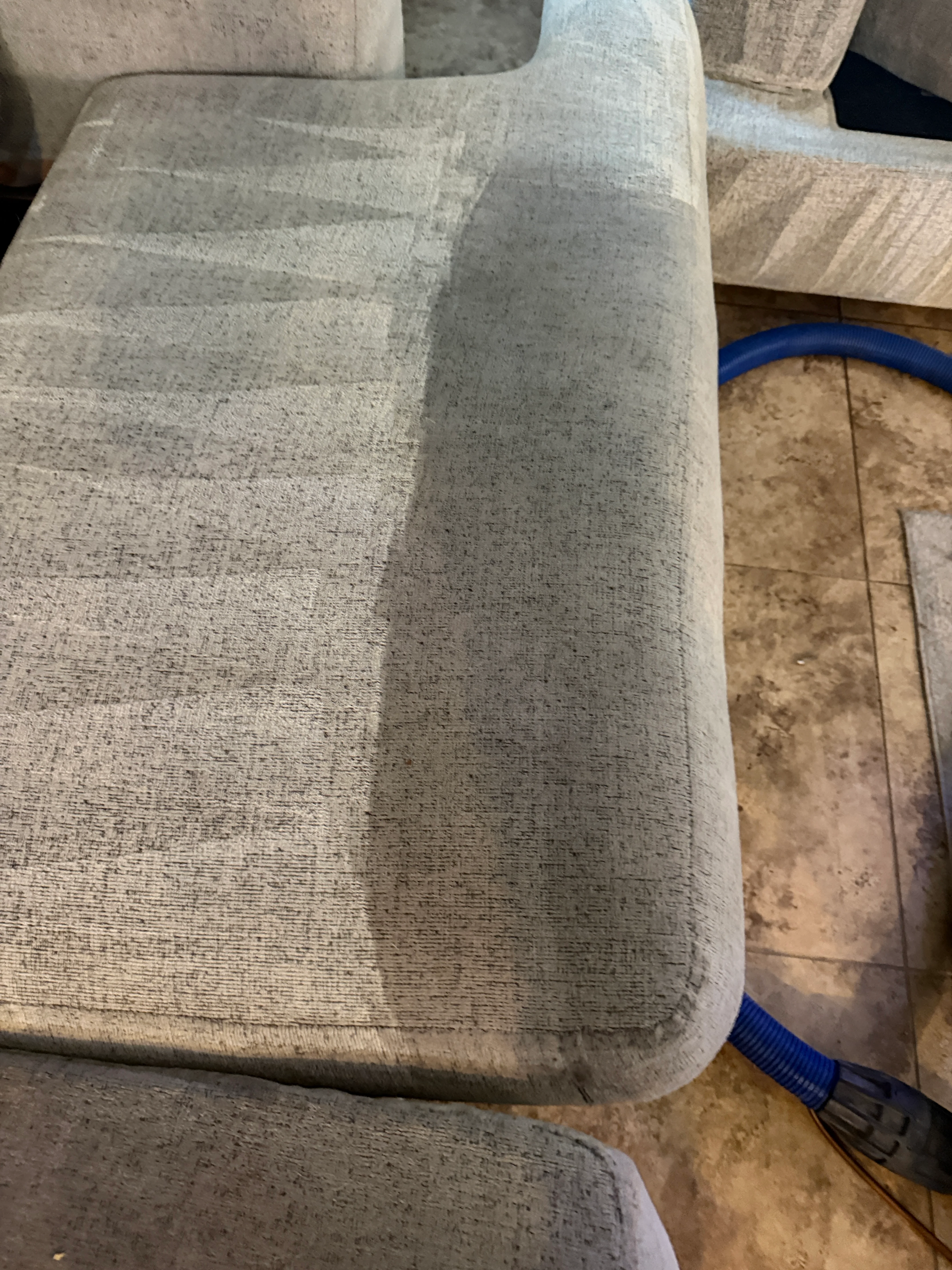Light beige upholstered chair seat and back cleaned to restore original fabric color