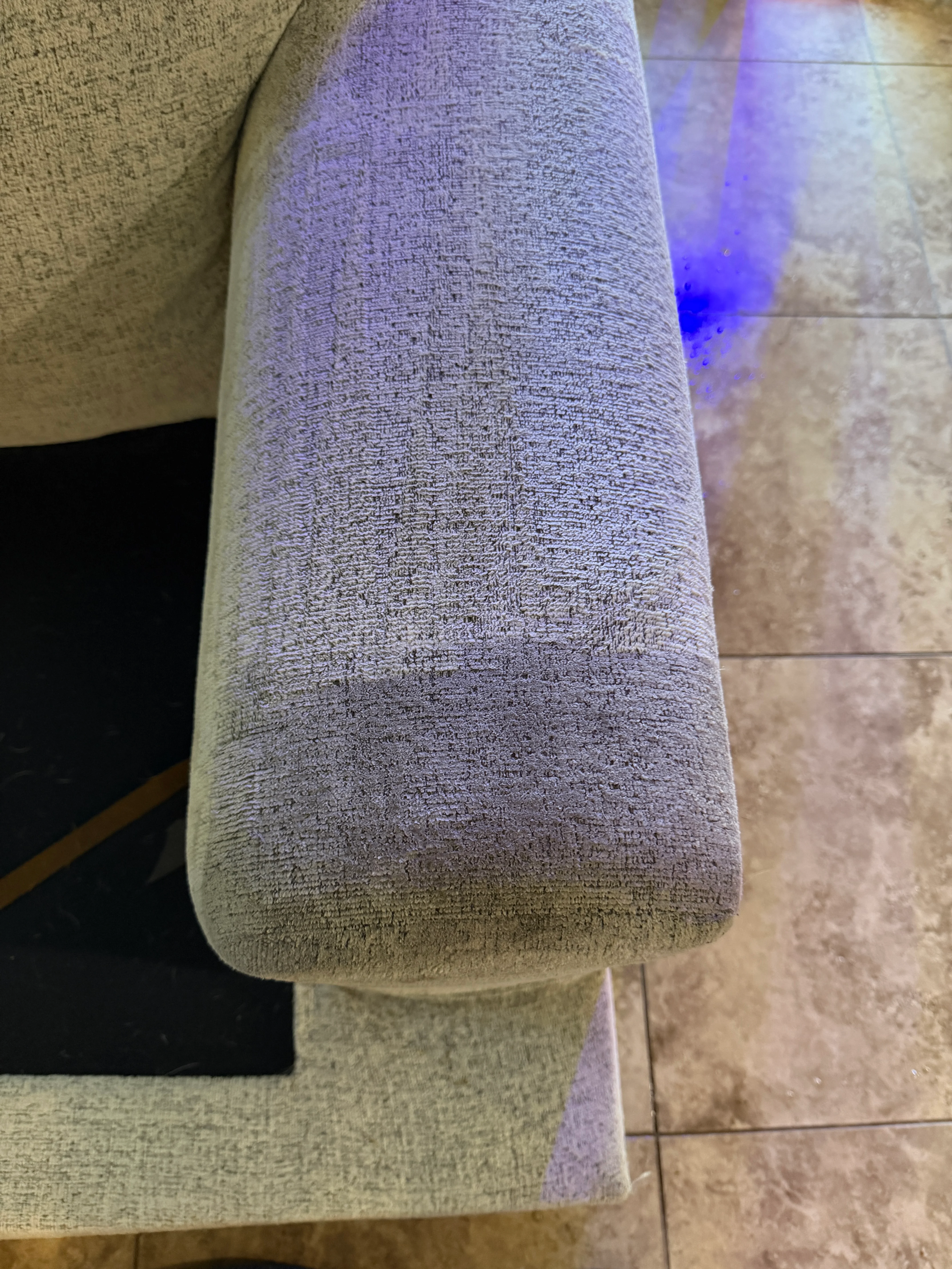 Gray woven upholstery ottoman after professional cleaning, showing restored fabric texture and color